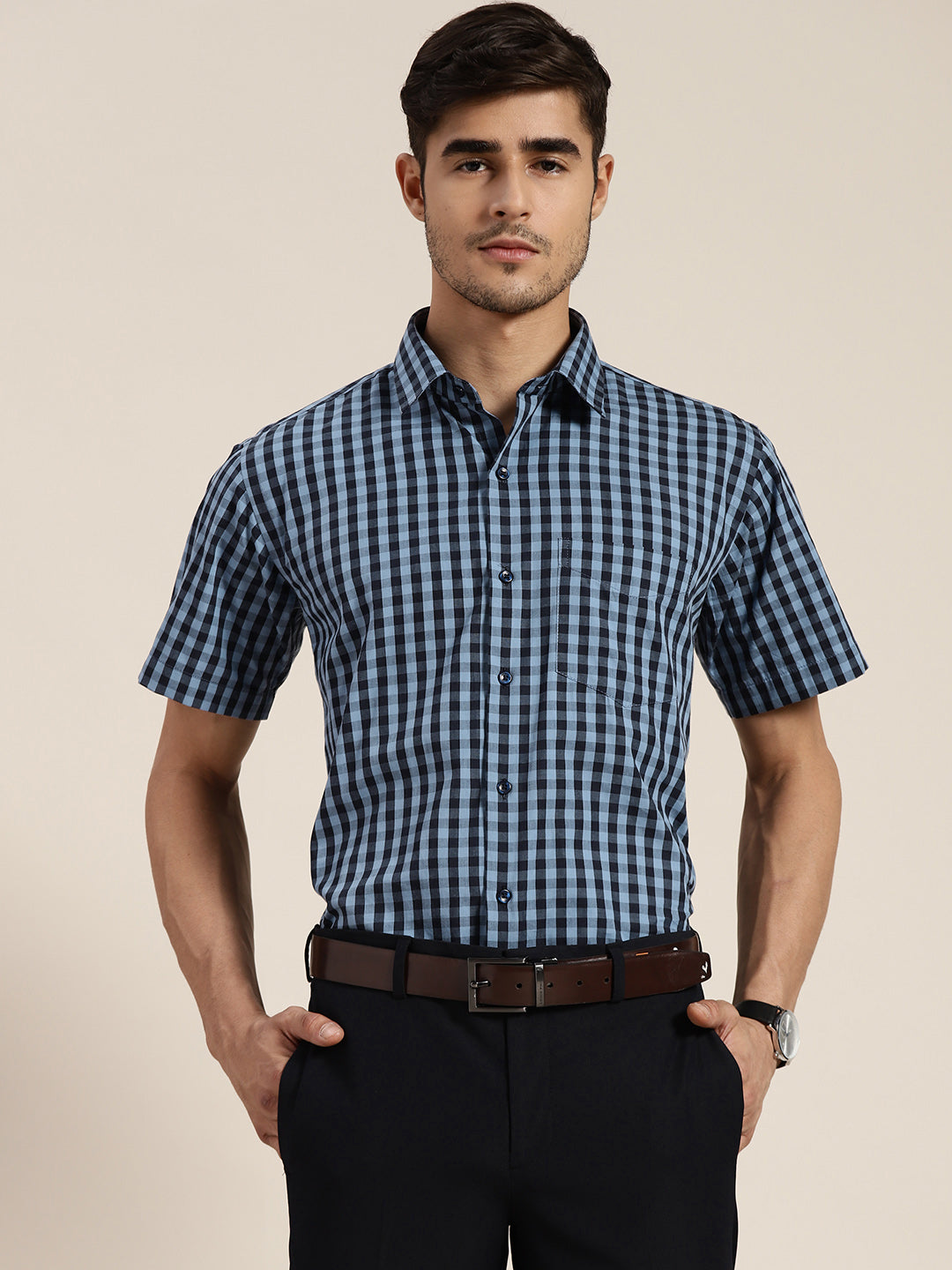 blue check shirt with black pants